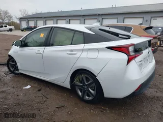 2021 Toyota Prius L Eco with VIN JTDKAMFUXM3137233, listed as a IAAI auction lot 40870395 with 60,000 mi miles. Bid and sale history available at carsss.com. Image 14.
