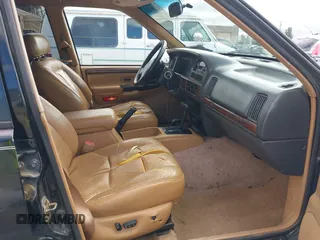 1996 Jeep Grand Cherokee Limited z VIN 1J4GZ78Y3TC191000, wystawiony jako IAAI lot #42259621 z przebiegiem 212 690 mil mil oraz . Historia ofert i sprzedaży dostępna na DreamBid. Obrazek 5.