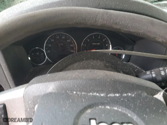 2010 Jeep Commander Sport with VIN 1J4RH4GK9AC115737, listed as a Copart auction lot 83028054 with 0 mi miles and Salvage Title. Bid and sale history available at carsss.com. Image 9.
