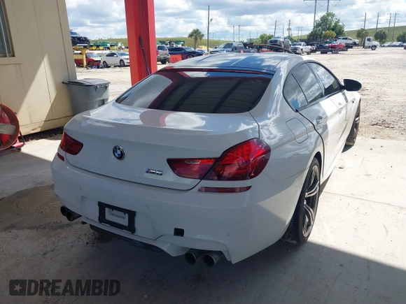 2014 BMW M6 z VIN WBS6C9C50EDV73809, wystawiony jako IAAI lot #41648991 z przebiegiem 68 054 mil mil oraz . Historia ofert i sprzedaży dostępna na DreamBid. Obrazek 4.