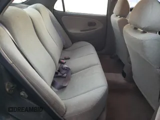 2000 Hyundai Elantra GLS z VIN KMHJF35F6YU890800, wystawiony jako Copart lot #76972294 z przebiegiem 159 134 mil mil oraz Szkoda całkowita • Salvage title. Historia ofert i sprzedaży dostępna na DreamBid. Obrazek 10.