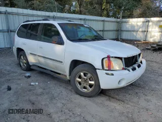2002 GMC Envoy SLT with VIN 1GKDS13S822460095, listed as a Copart auction lot 77004764 with 267,716 mi miles and Salvage Title. Bid and sale history available at carsss.com. Image 4.