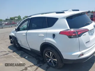2018 Toyota RAV4 XLE z VIN 2T3WFREV1JW459553, wystawiony jako IAAI lot #42423474 z przebiegiem 129 523 mil mil oraz . Historia ofert i sprzedaży dostępna na DreamBid. Obrazek 14.