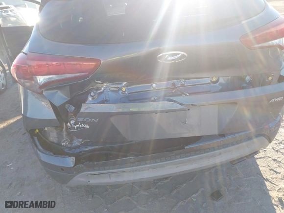 2018 Hyundai Tucson Value with VIN KM8J3CA2XJU776526, listed as a IAAI auction lot 41322657 with 102,444 mi miles. Bid and sale history available at carsss.com. Image 6.