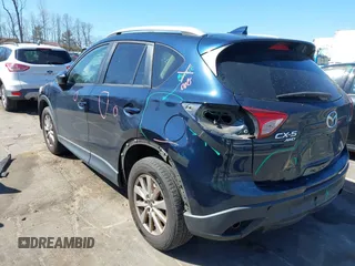 2016 Mazda CX-5 Touring with VIN JM3KE4CY0G0631786, listed as a IAAI auction lot 41761214 with 220,058 mi miles. Bid and sale history available at carsss.com. Image 6.