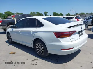 2019 Volkswagen Jetta S z VIN 3VWCB7BU9KM144272, wystawiony jako IAAI lot #41997518 z przebiegiem 91 950 mil mil oraz . Historia ofert i sprzedaży dostępna na DreamBid. Obrazek 14.