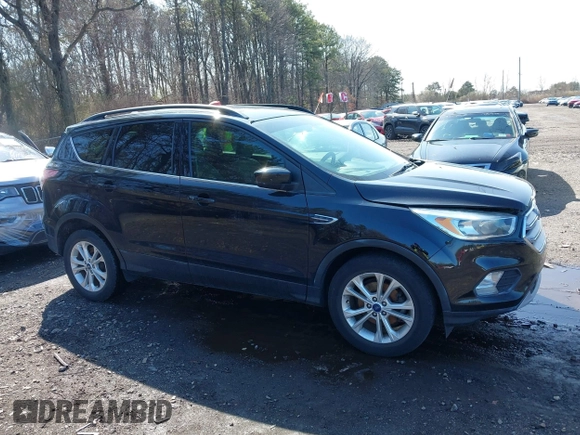 2018 Ford Escape SE with VIN 1FMCU0GD2JUA65979, listed as a IAAI auction lot 41894516 with 145,424 mi miles. Bid and sale history available at carsss.com. Image 13.