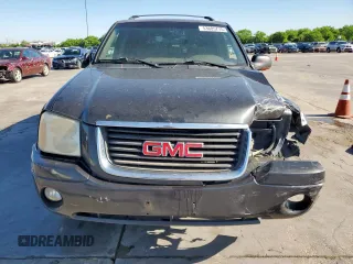 2003 GMC Envoy SLT z VIN 1GKDS13S332281271, wystawiony jako Copart lot #53685775 z przebiegiem 236 997 mil mil oraz Szkody całkowita. Historia ofert i sprzedaży dostępna na DreamBid. Obrazek 5.