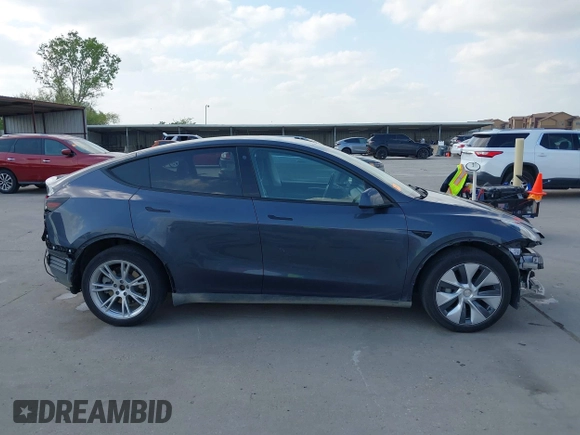 2023 Tesla Model Y Long Range with VIN 7SAYGDEEXPA078629, listed as a IAAI auction lot 42046354 with 27,245 mi miles and . Bid and sale history available at DreamBid. Image 14.