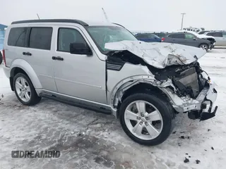 2011 Dodge Nitro Heat with VIN 1D4PU4GX1BW607458, listed as a IAAI auction lot 41279270 with 90,969 mi miles. Bid and sale history available at carsss.com. Image 1.
