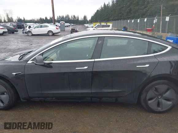 2019 Tesla Model 3 Mid Range with VIN 5YJ3E1EAXKF296378, listed as a IAAI auction lot 41739616 with 77,100 mi miles and . Bid and sale history available at DreamBid. Image 13.