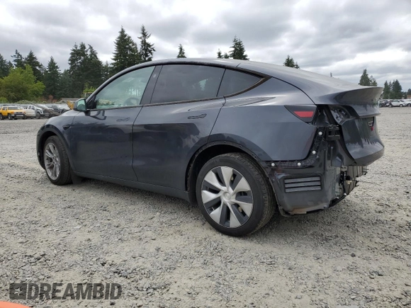 2024 Tesla Model Y Long Range with VIN 7SAYGDEE9RF069801, listed as a Copart auction lot 60857145 with 18,808 mi miles and Salvage title. Bid and sale history available at DreamBid. Image 2.
