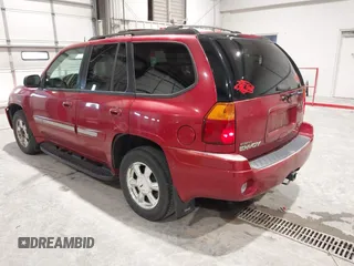 2005 GMC Envoy SLT with VIN 1GKDT13S352324863, listed as a IAAI auction lot 41707649 with 247,326 mi miles. Bid and sale history available at carsss.com. Image 3.