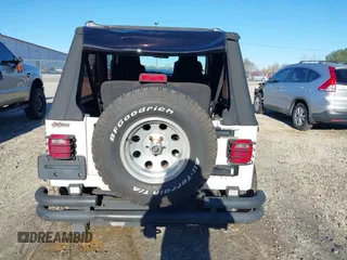 2005 Jeep Wrangler Unlimited with VIN 1J4FA44SX5P316055, listed as a IAAI auction lot 41586898 with 218,181 mi miles. Bid and sale history available at carsss.com. Image 16.