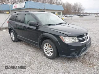 2014 Dodge Journey SXT with VIN 3C4PDCBG1ET142687, listed as a IAAI auction lot 41698232 with 170,521 mi miles. Bid and sale history available at carsss.com. Image 1.