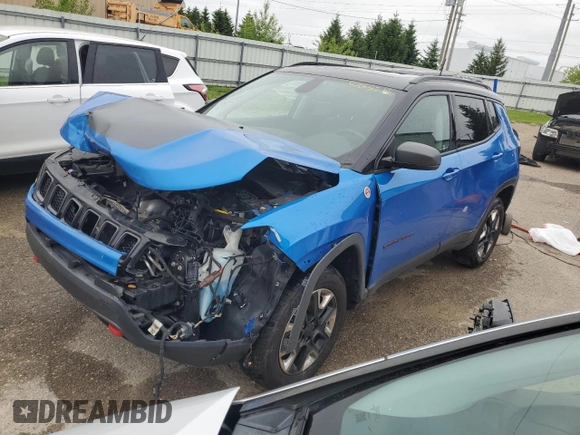 2018 Jeep Compass Trailhawk with VIN 3C4NJDDBXJT139496, listed as a Copart auction lot 57068265 with 105,809 mi miles and Salvage title. Bid and sale history available at DreamBid. Image 1.
