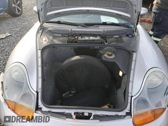 2000 Porsche Boxster z VIN WP0CA2980YU626179, wystawiony jako Copart lot #44728325 z przebiegiem 103 173 mil mil oraz Szkody całkowita. Historia ofert i sprzedaży dostępna na DreamBid. Obrazek 11.