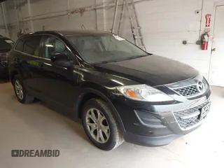 2011 Mazda CX-9 Touring with VIN JM3TB2CV1B0300621, listed as a IAAI auction lot 42002068 with 185,162 mi miles and . Bid and sale history available at carsss.com. Image 1.