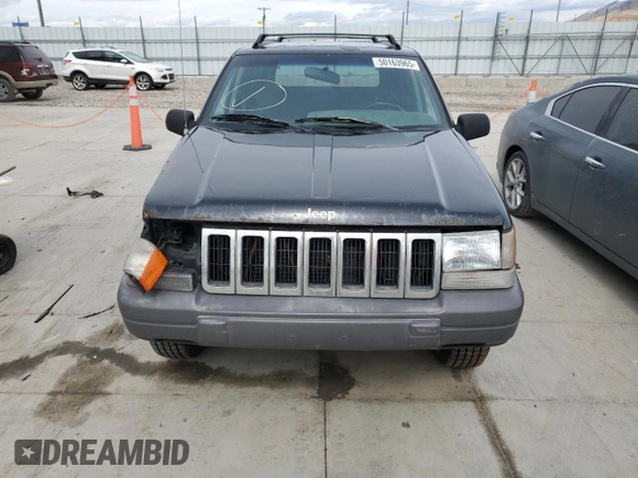 1996 Jeep Grand Cherokee with VIN 1J4EZ58S8TC106529, listed as a Copart auction lot 50163965 with 226,951 mi miles and Salvage title. Bid and sale history available at DreamBid. Image 5.