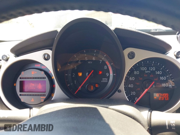 2013 Nissan 370Z Touring z VIN JN1AZ4EH2DM384011, wystawiony jako IAAI lot #42274166 z przebiegiem 87 499 mil mil oraz . Historia ofert i sprzedaży dostępna na DreamBid. Obrazek 7.