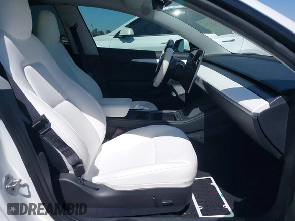 2023 Tesla Model 3 z VIN 5YJ3E1EA5PF517893, wystawiony jako IAAI lot #42515181 z przebiegiem 38 538 mil mil oraz . Historia ofert i sprzedaży dostępna na DreamBid. Obrazek 5.