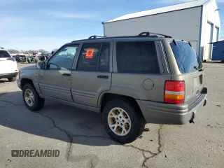 1997 Jeep Grand Cherokee Limited with VIN 1J4GZ78Y4VC754624, listed as a Copart auction lot 49884435 with 144,682 mi miles and Salvage Title. Bid and sale history available at carsss.com. Image 2.