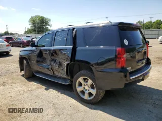 2018 Chevrolet Tahoe Premier with VIN 1GNSKCKC1JR133625, listed as a Copart auction lot 54900974 with 130,921 mi miles and Salvage title. Bid and sale history available at DreamBid. Image 2.