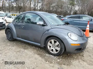 2007 Volkswagen Beetle with VIN 3VWPW31CX7M504745, listed as a Copart auction lot 48799535 with 128,267 mi miles and Salvage Title. Bid and sale history available at DreamBid. Image 4.