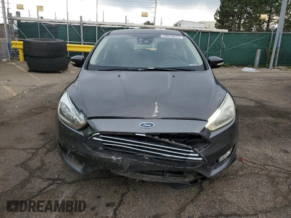 2016 Ford Focus Titanium z VIN 1FADP3N27GL329026, wystawiony jako Copart lot #60910475 z przebiegiem 98 794 mil mil oraz Szkoda całkowita • Salvage title. Historia ofert i sprzedaży dostępna na DreamBid. Obrazek 5.
