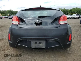 2013 Hyundai Veloster w/Gray Int z VIN KMHTC6AD9DU110094, wystawiony jako Copart lot #64660645 z przebiegiem 149 746 mil mil oraz Szkoda całkowita • Salvage title. Historia ofert i sprzedaży dostępna na DreamBid. Obrazek 6.