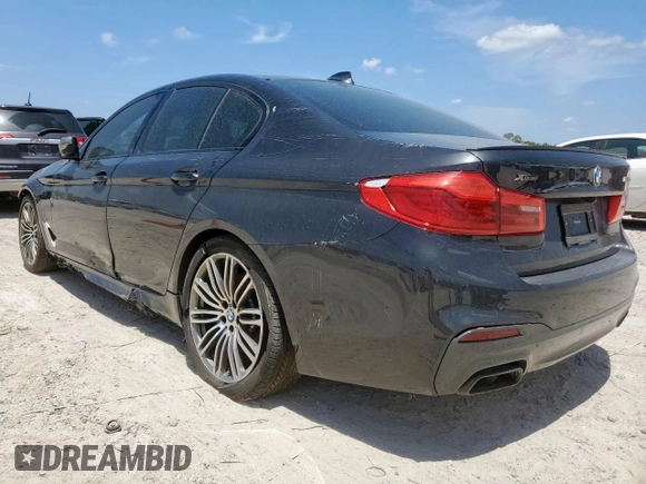 2019 BMW 5 Series M550i xDrive with VIN WBAJB9C51KB287797, listed as a Copart auction lot 65382465 with 61,459 mi miles and Salvage title. Bid and sale history available at DreamBid. Image 2.