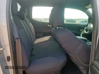 2019 Toyota Tacoma SR z VIN 5TFCZ5AN6KX211952, wystawiony jako Copart lot #58964815 z przebiegiem 97 774 mil mil oraz Szkoda całkowita • Salvage title. Historia ofert i sprzedaży dostępna na DreamBid. Obrazek 10.