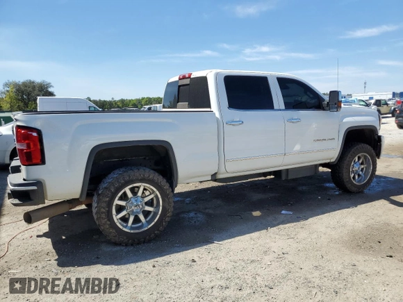 2016 GMC Sierra 2500HD Denali z VIN 1GT12UE84GF106026, wystawiony jako Copart lot #50755335 z przebiegiem 127 039 mil mil oraz Szkoda całkowita • Salvage title. Historia ofert i sprzedaży dostępna na DreamBid. Obrazek 3.