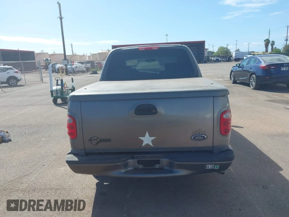 2002 Ford F-150 Harley Davidson with VIN 1FTRW07312KC88379, listed as a IAAI auction lot 41657219 with 1 mi miles. Bid and sale history available at carsss.com. Image 16.