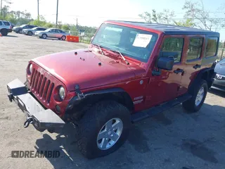 2011 Jeep Wrangler Unlimited Sport with VIN 1J4BA3H18BL598323, listed as a IAAI auction lot 41958043 with 154,354 mi miles. Bid and sale history available at carsss.com. Image 2.