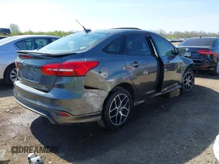 2015 Ford Focus SE with VIN 1FADP3F29FL268677, listed as a IAAI auction lot 42037244 with 118,018 mi miles. Bid and sale history available at carsss.com. Image 4.