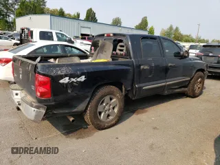 2005 Dodge Dakota Laramie with VIN 1D7HW58N65S161629, listed as a Copart auction lot 66570164 with 205,984 mi miles and Salvage Title. Bid and sale history available at carsss.com. Image 3.