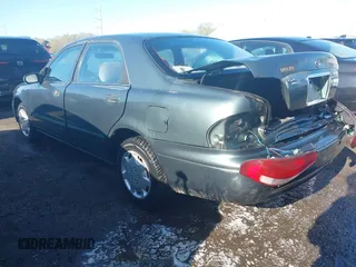 1998 Mazda 626 DX with VIN 1YVGF22C4W5768778, listed as a IAAI auction lot 41971066 with 119,168 mi miles. Bid and sale history available at carsss.com. Image 3.