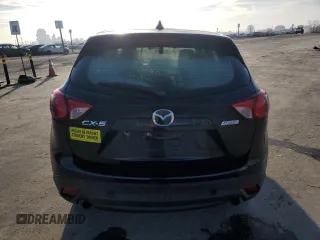 2015 Mazda CX-5 Sport z VIN JM3KE2BE6F0491107, wystawiony jako Copart lot #42462395 z przebiegiem 82 528 mil mil oraz Szkoda całkowita • Salvage title. Historia ofert i sprzedaży dostępna na DreamBid. Obrazek 6.