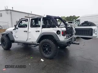 2018 Jeep Wrangler Unlimited Sport with VIN 1C4HJXDG0JW233696, listed as a IAAI auction lot 42523474 with 66,961 mi miles and . Bid and sale history available at DreamBid. Image 3.