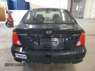 2005 Hyundai Accent GLS with VIN KMHCG35C95U327960, listed as a Copart auction lot 77151314 with 101,556 mi miles and Clean Title. Bid and sale history available at carsss.com. Image 6.