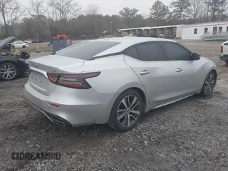 2019 Nissan Maxima Platinum z VIN 1N4AA6AV6KC372254, wystawiony jako IAAI lot #41519515 z przebiegiem 124 326 mil mil oraz . Historia ofert i sprzedaży dostępna na DreamBid. Obrazek 4.