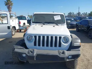 2023 Jeep Wrangler Willys with VIN 1C4HJXDG0PW638871, listed as a IAAI auction lot 42700599 with 16,171 mi miles and . Bid and sale history available at DreamBid. Image 12.