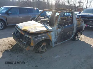 1996 Chevrolet Tracker z VIN 2CNBJ1869T6914128, wystawiony jako IAAI lot #41399004 z przebiegiem Nie podano mil oraz . Historia ofert i sprzedaży dostępna na DreamBid. Obrazek 2.