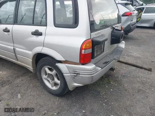 2000 Suzuki Grand Vitara JLX with VIN JS3TD62V5Y4117740, listed as a IAAI auction lot 42088696 with 166,484 mi miles. Bid and sale history available at carsss.com. Image 6.