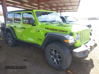 2021 Jeep Wrangler Unlimited Rubicon z VIN 1C4JJXFM4MW833906, wystawiony jako IAAI lot #42153789 z przebiegiem 83 128 mil mil oraz . Historia ofert i sprzedaży dostępna na DreamBid. Obrazek 1.