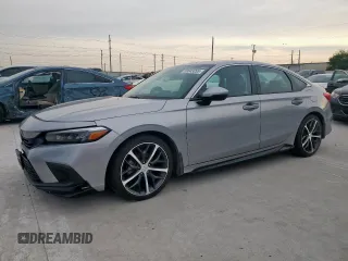 2023 Honda Civic Touring with VIN 2HGFE1F93PH305183, listed as a Copart auction lot 59043095 with 57,123 mi miles and Salvage title. Bid and sale history available at DreamBid. Image 1.
