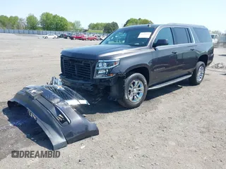 2018 Chevrolet Suburban LT with VIN 1GNSCHKCXJR128787, listed as a IAAI auction lot 41909965 with 123,020 mi miles. Bid and sale history available at carsss.com. Image 2.