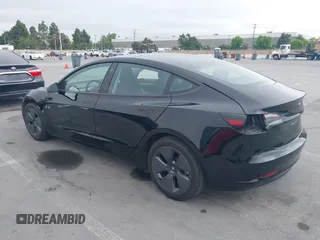 2023 Tesla Model 3 with VIN 5YJ3E1EA5PF647737, listed as a IAAI auction lot 42430145 with 20,525 mi miles and . Bid and sale history available at DreamBid. Image 3.