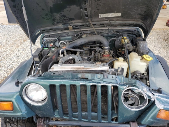 1999 Jeep Wrangler Sport with VIN 1J4FY19S0XP402688, listed as a Copart auction lot 58968125 with 211,910 mi miles and Salvage title. Bid and sale history available at DreamBid. Image 11.